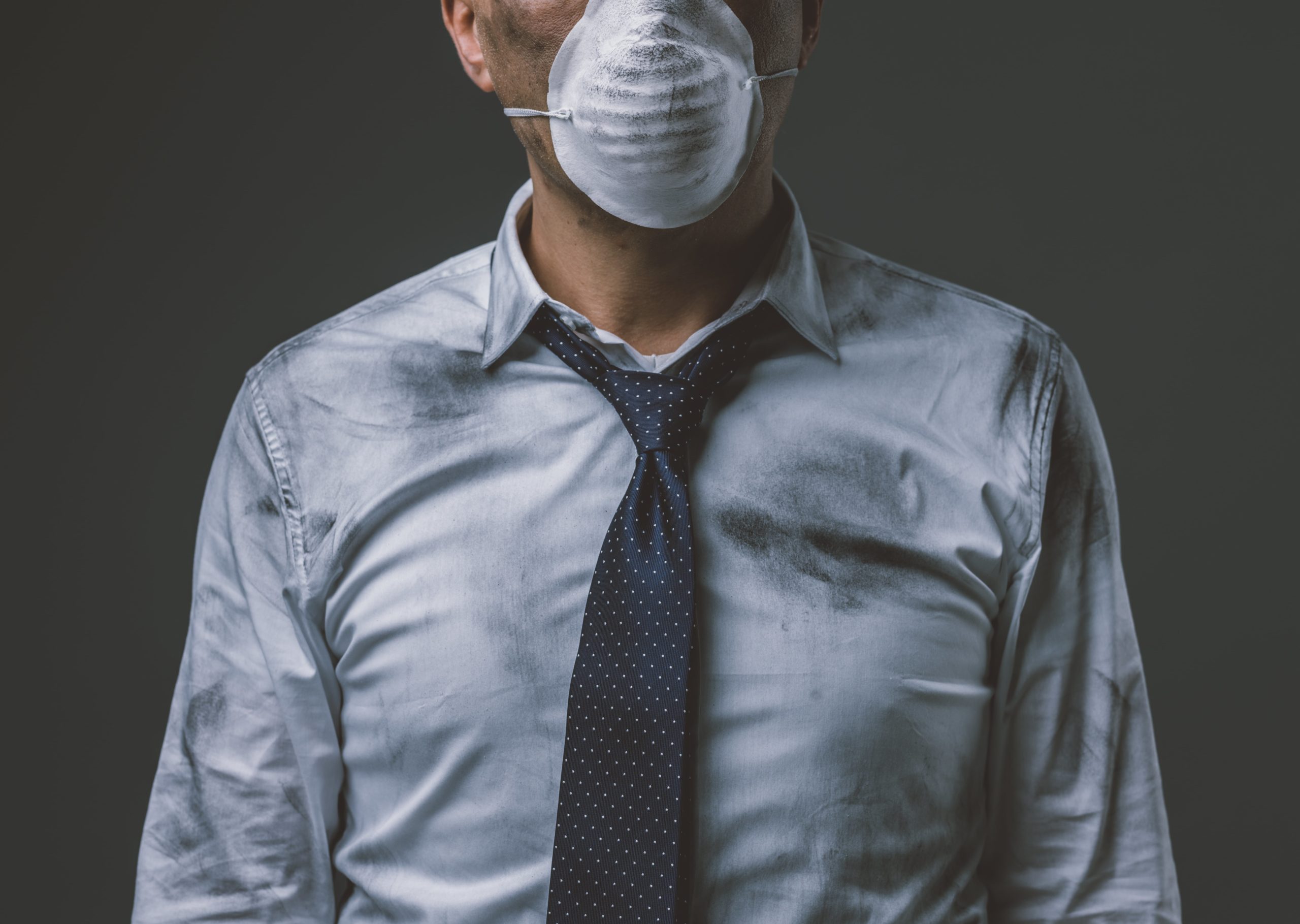 businessman with mask and air pollution